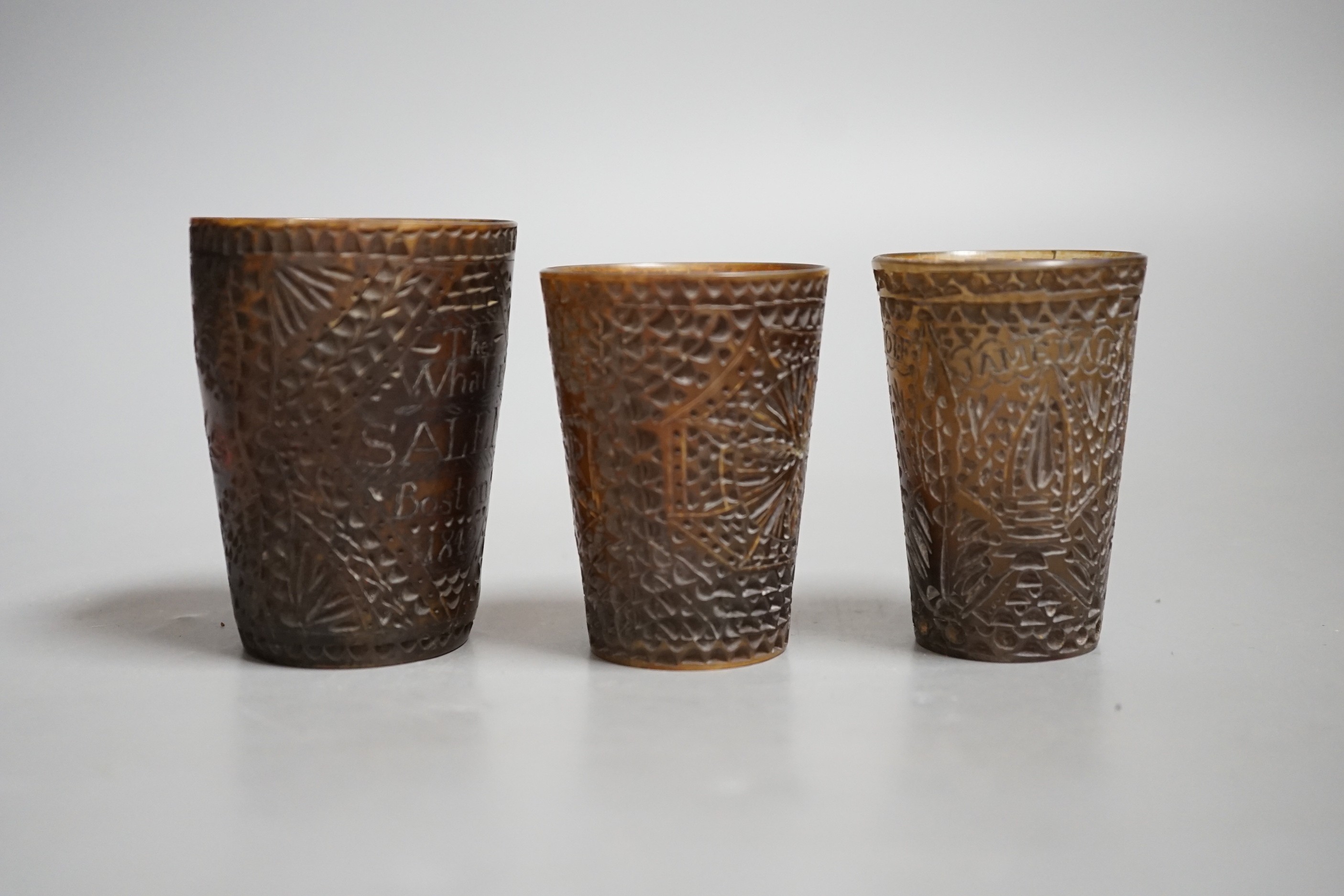 Three 19th century scrimshaw carved baleen cups. All inscribed and dated, Tallest 7cm